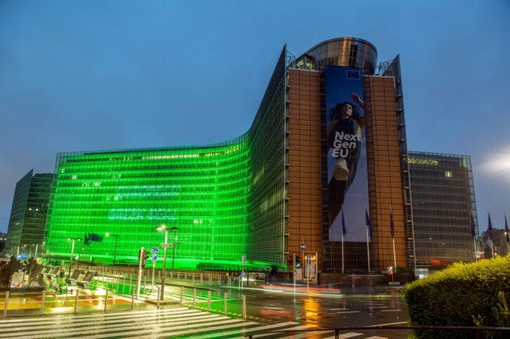 The Berlaymont building lit in green to mark European Green Deal