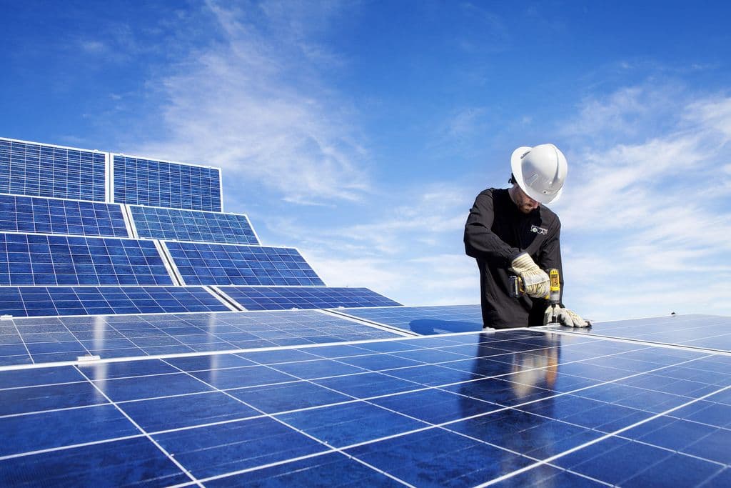 Electrical apprentice Eric Penel works on the solar reference array, which has been installed on the roof of the Shaw Theatre at NAIT's Main Campus in Edmonton.